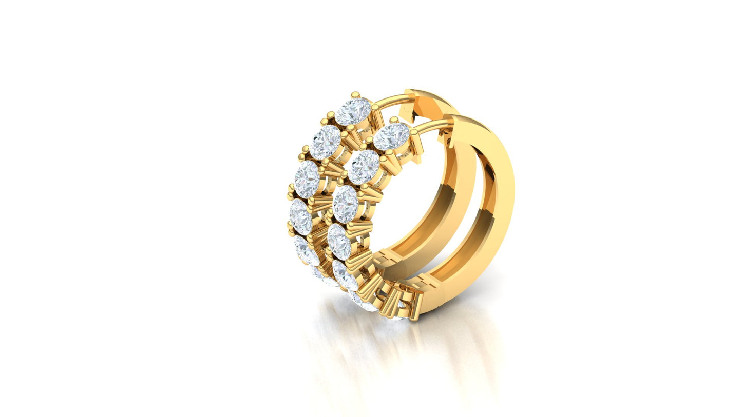 Gold hoop earring with embedded diamonds on a white background