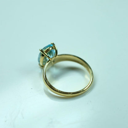 Elegant  Blue Topaz Gold Solitaire Ring