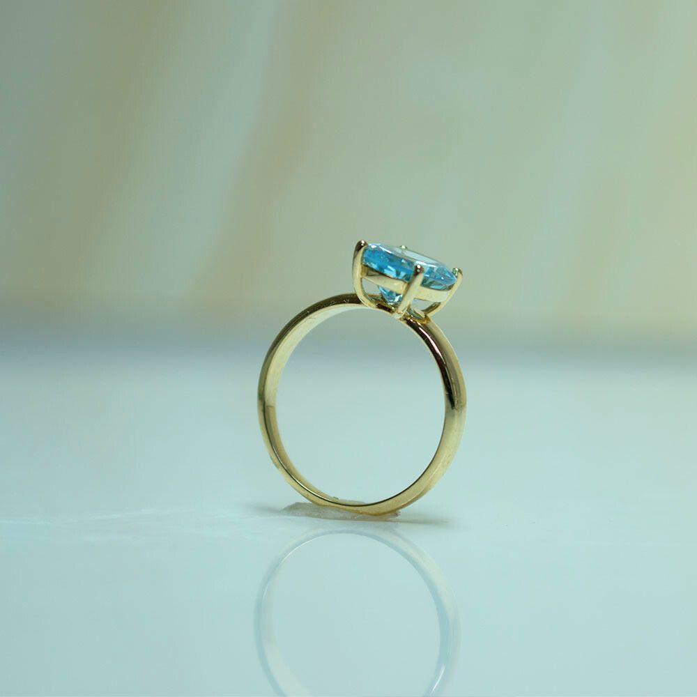 Elegant  Blue Topaz Gold Solitaire Ring