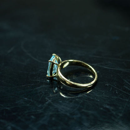 Elegant  Blue Topaz Gold Solitaire Ring