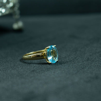 Elegant  Blue Topaz Gold Solitaire Ring