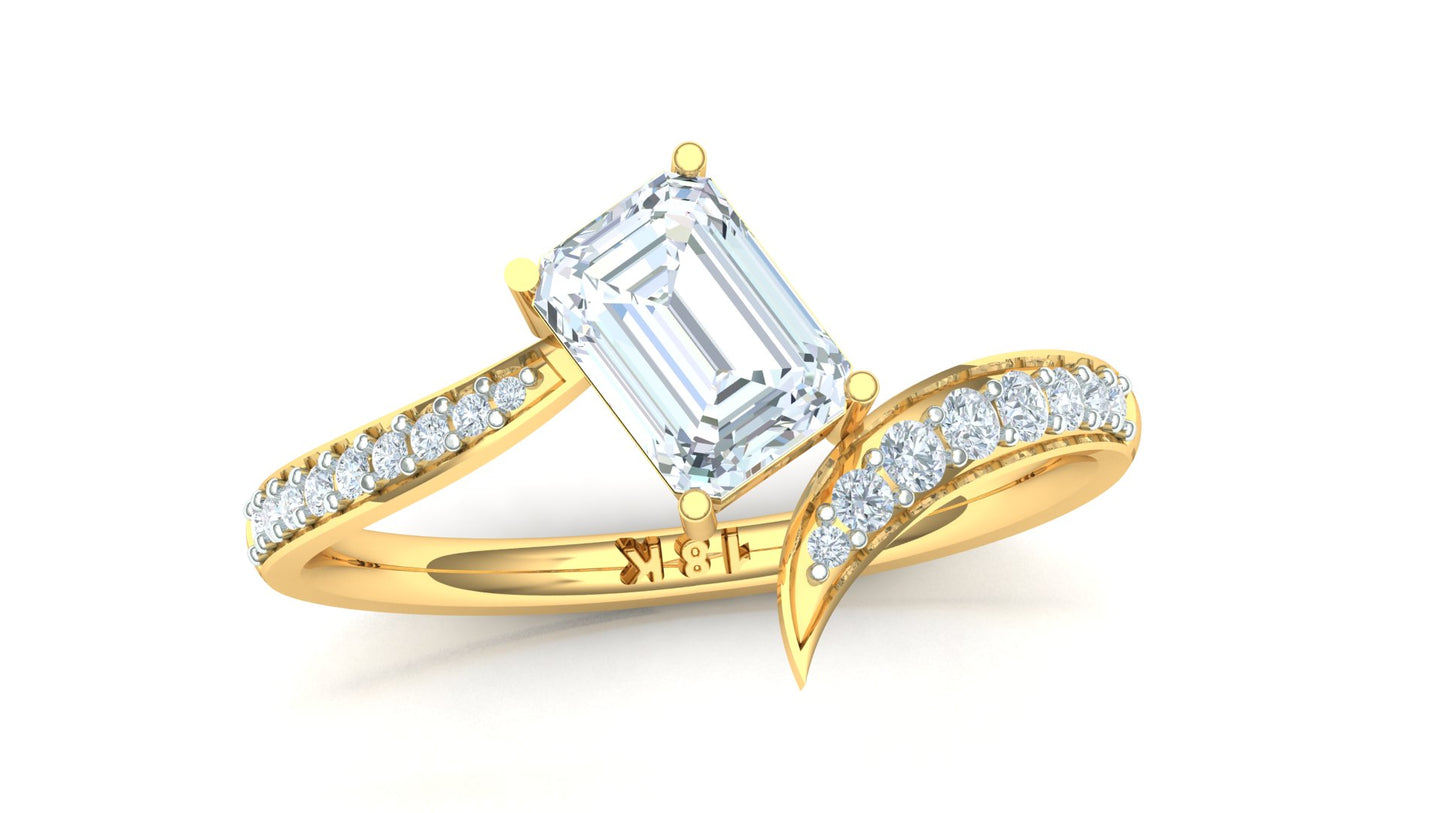 Gold ring with emerald-cut diamond and smaller diamonds on a white background