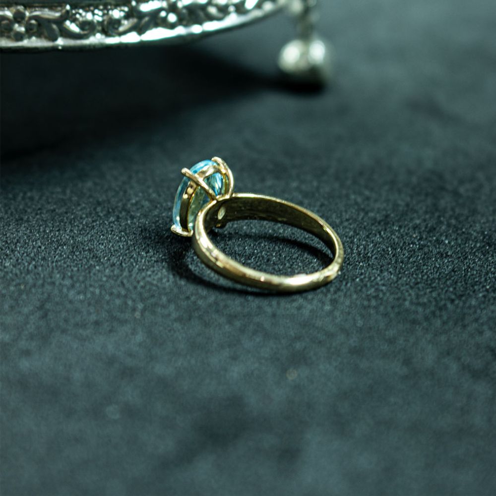 Elegant  Blue Topaz Gold Solitaire Ring