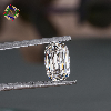 Anirudh jewels Diamond held between tweezers against a blurred background