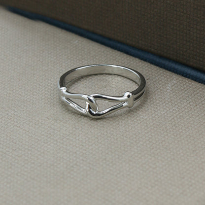 Sleek White Gold Love Knot Ring