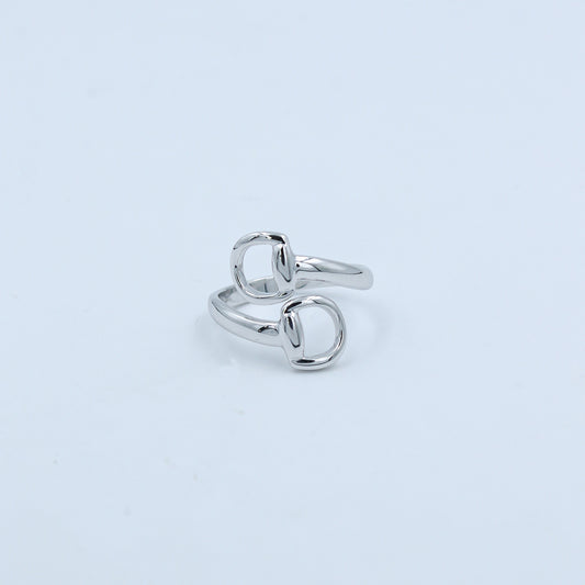 Silver ring on a light gray background