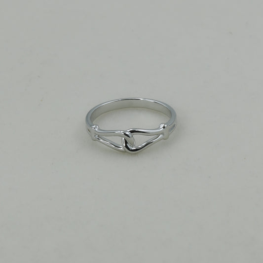 Silver ring on a light gray background