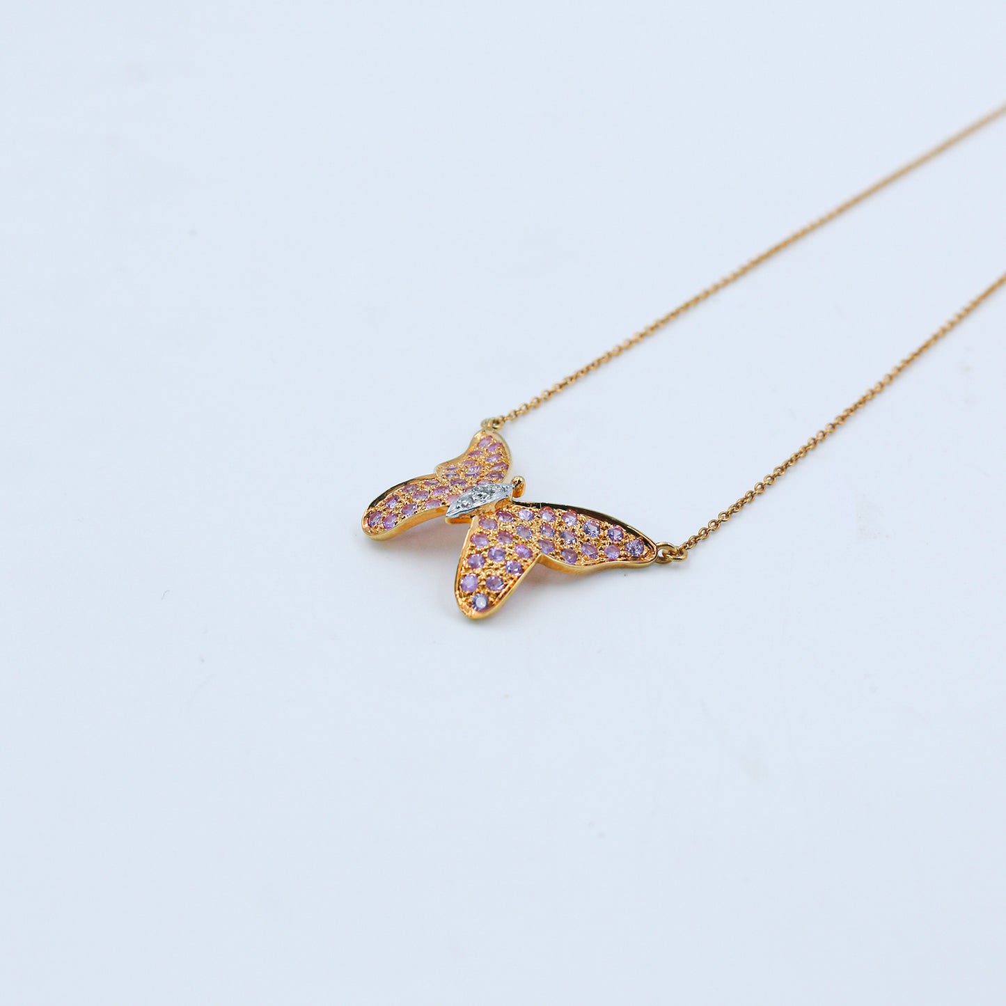 Pink Sapphire & Diamond Butterfly Pendant in Gold