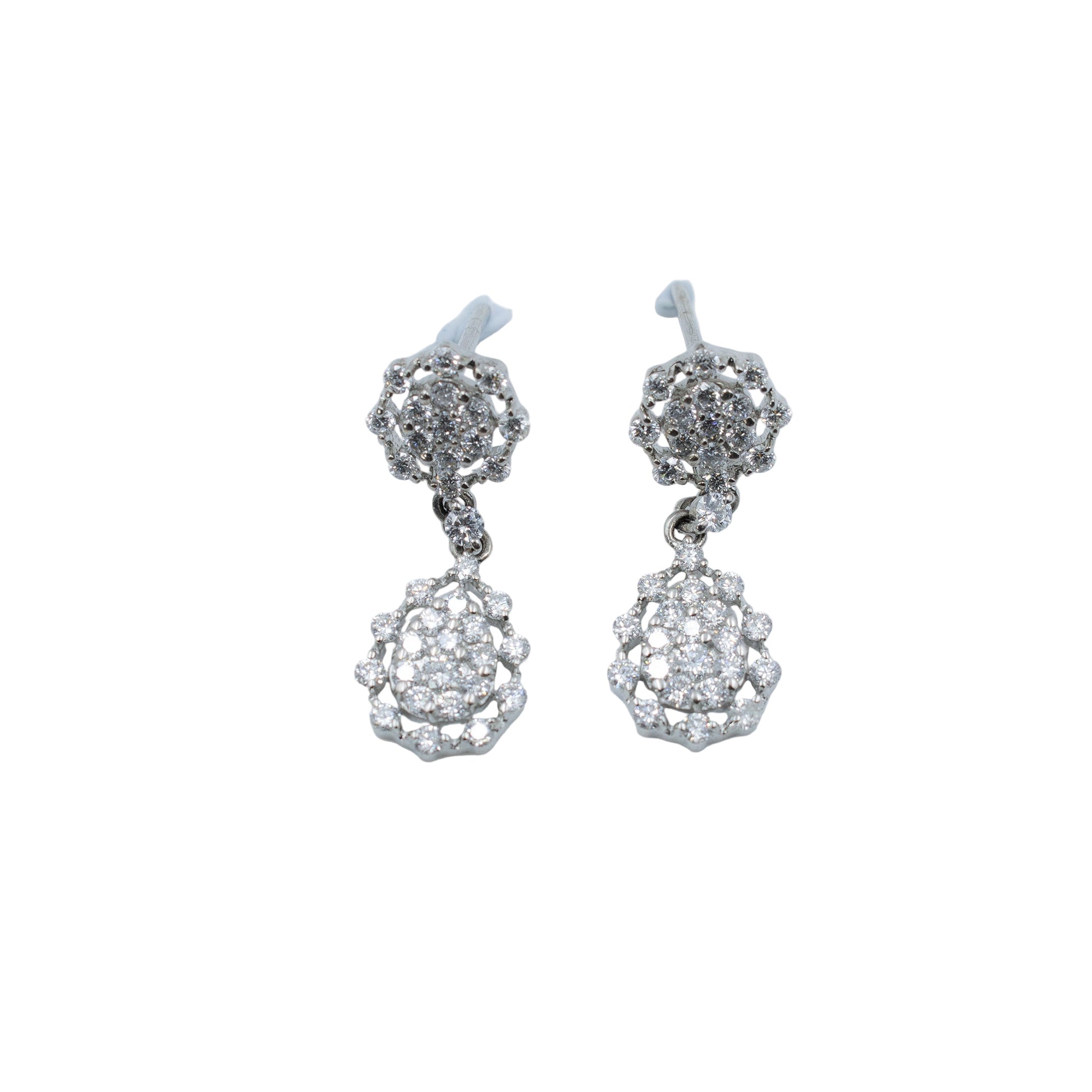 Pair of silver earrings with clear stones on a light gray background