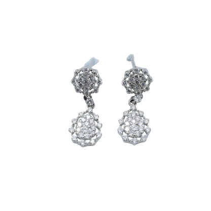 Pair of silver earrings with clear stones on a light gray background