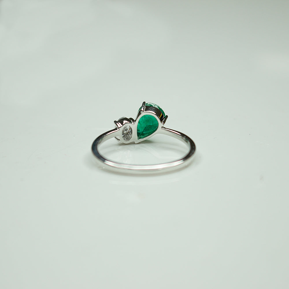 Pear Shape Emerald and Round Diamond Two-Stone Bypass Ring in 14K White Gold