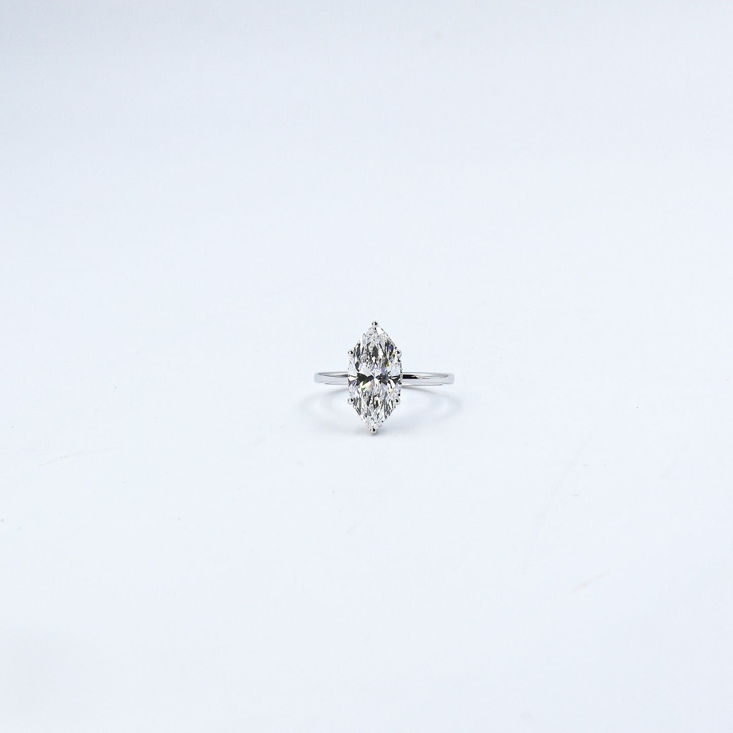 White Gold Marquise Solitaire Diamond Ring with Hidden Accents