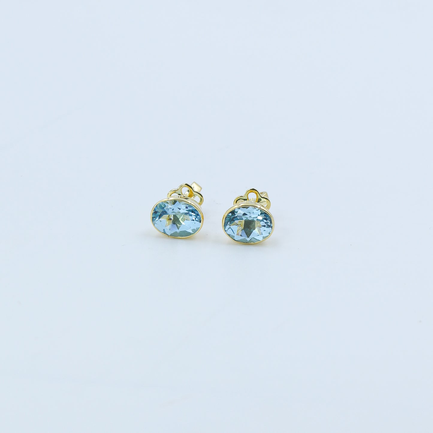 Yellow Gold Blue Topaz Oval Stud Earrings