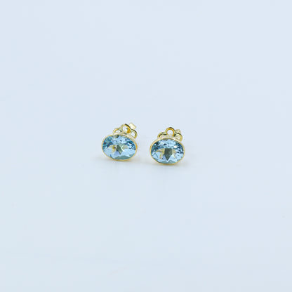 Yellow Gold Blue Topaz Oval Stud Earrings