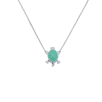 Necklace with a green pendant on a light gray background