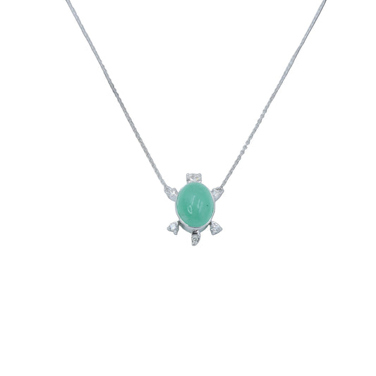 Necklace with a green pendant on a light gray background