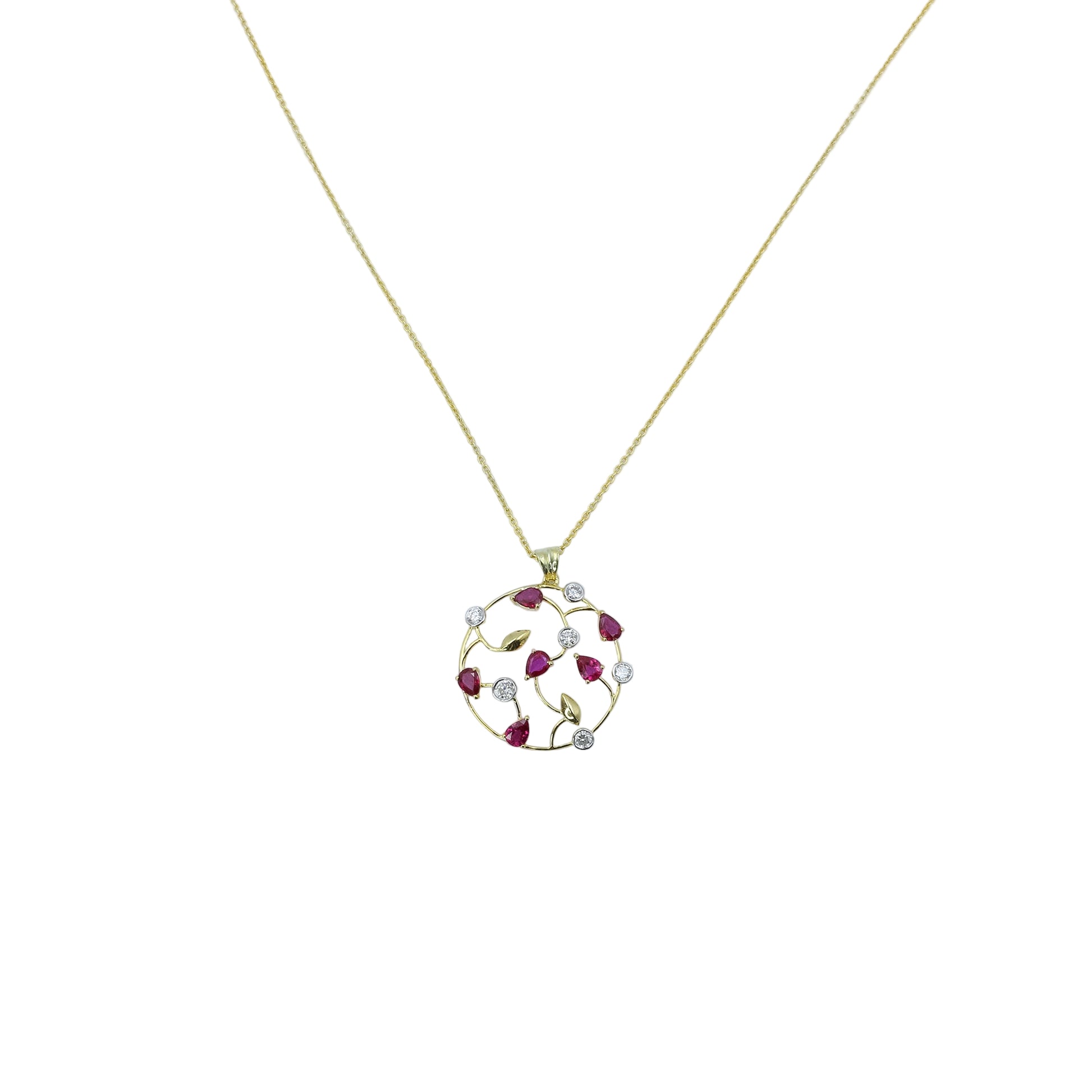 Gold necklace with a circular pendant featuring red stones on a light blue background