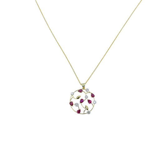 Gold necklace with a circular pendant featuring red stones on a light blue background