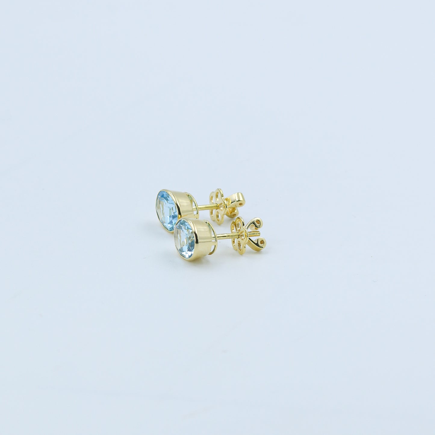 Yellow Gold Blue Topaz Oval Stud Earrings