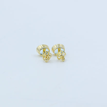 Yellow Gold Blue Topaz Oval Stud Earrings