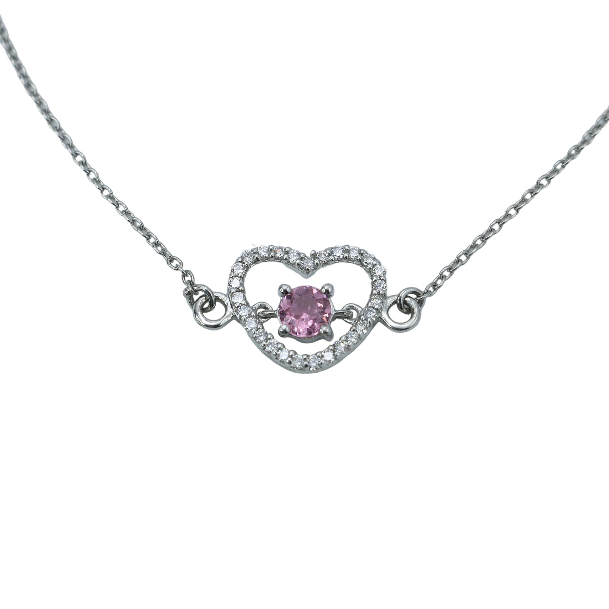 Necklace with a heart-shaped pendant featuring a pink gemstone on a light gray background