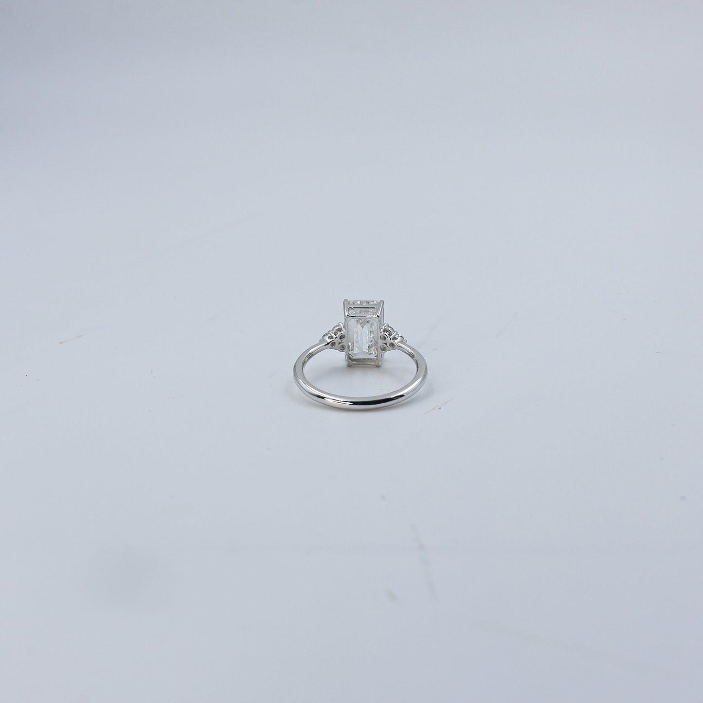 White Gold Emerald Cut Solitaire Diamond Ring with Side Accents