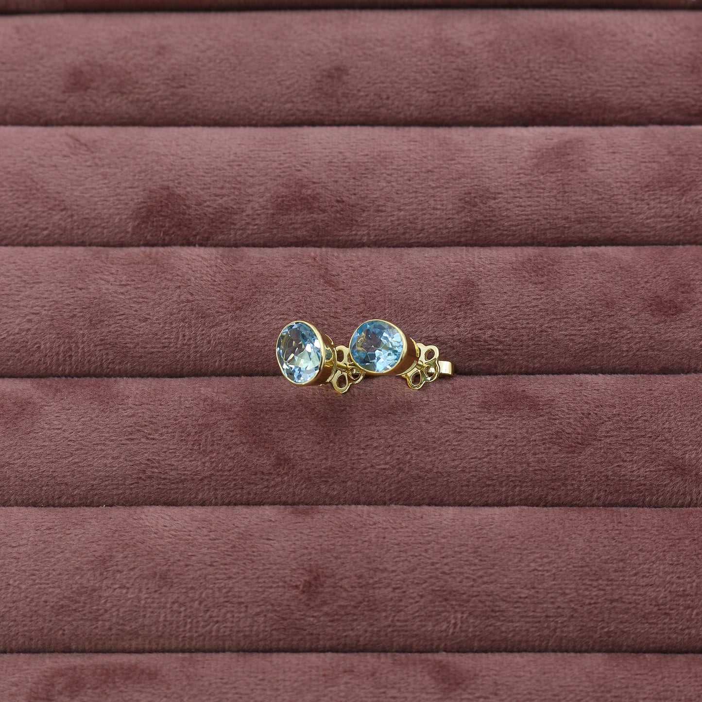 Yellow Gold Blue Topaz Oval Stud Earrings