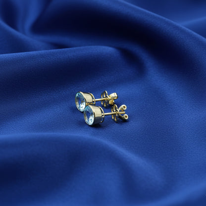Yellow Gold Blue Topaz Oval Stud Earrings