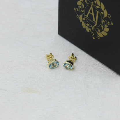 Yellow Gold Blue Topaz Oval Stud Earrings