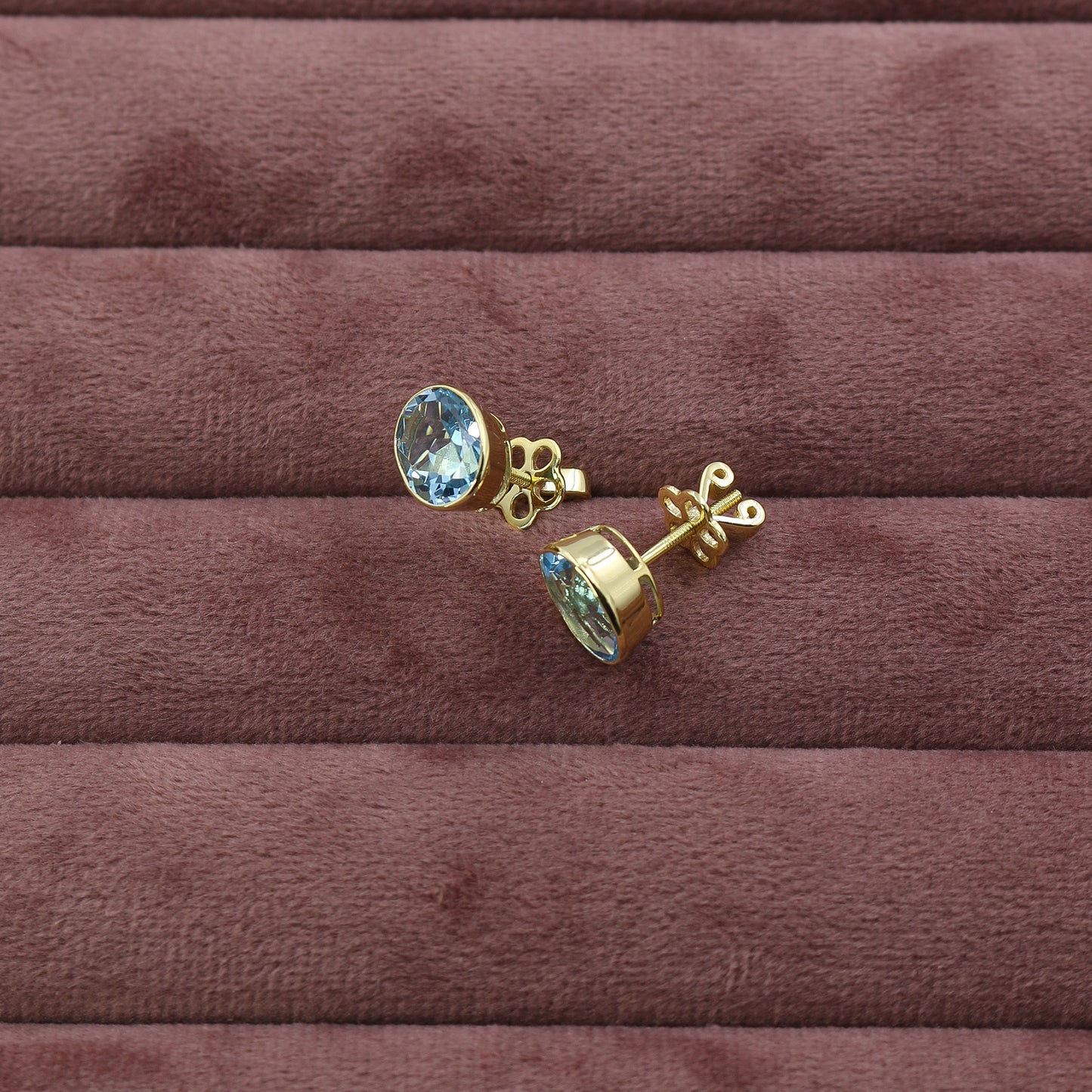 Yellow Gold Blue Topaz Oval Stud Earrings