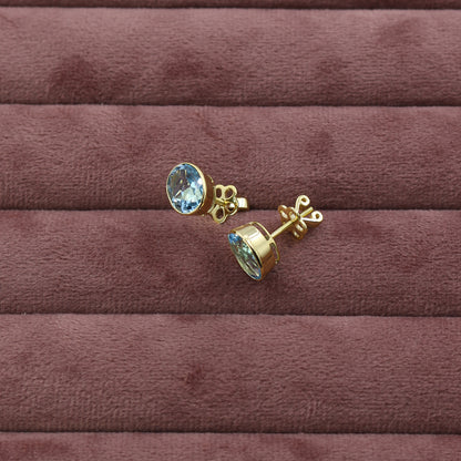 Yellow Gold Blue Topaz Oval Stud Earrings