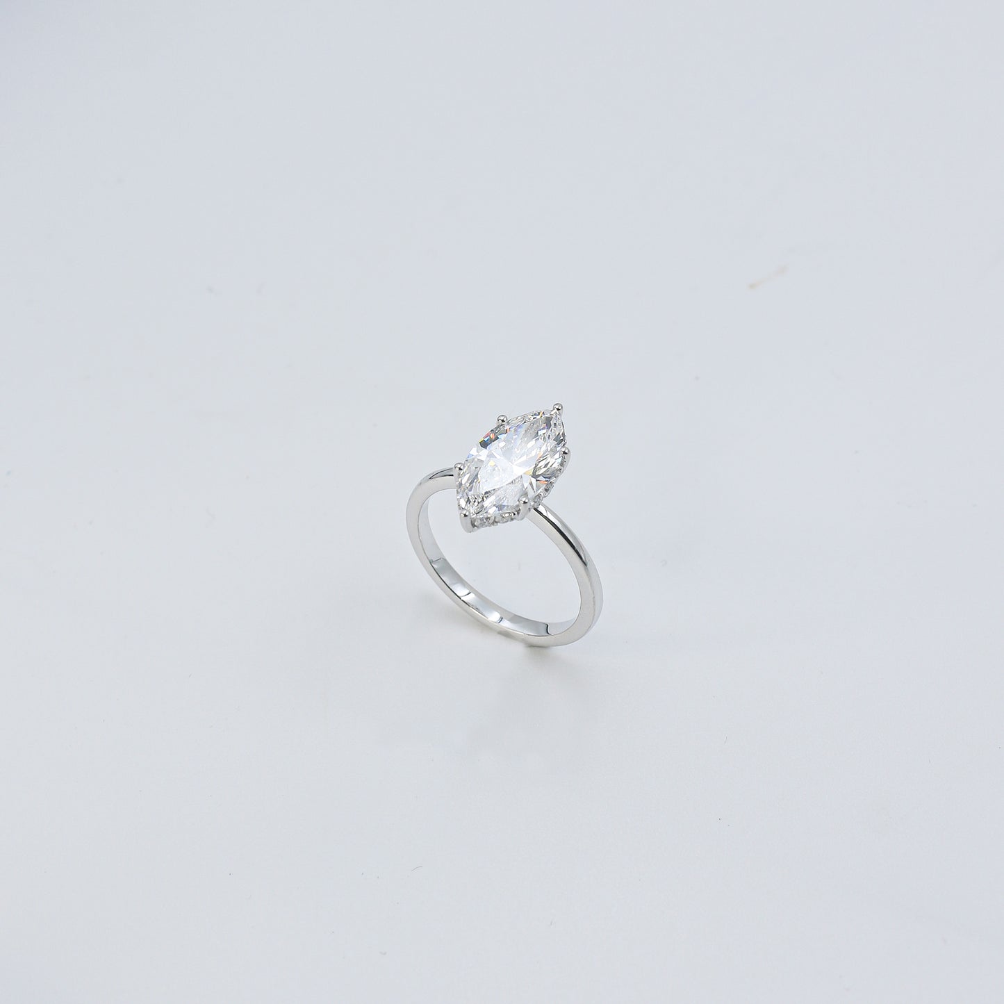 White Gold Marquise Solitaire Diamond Ring with Hidden Accents
