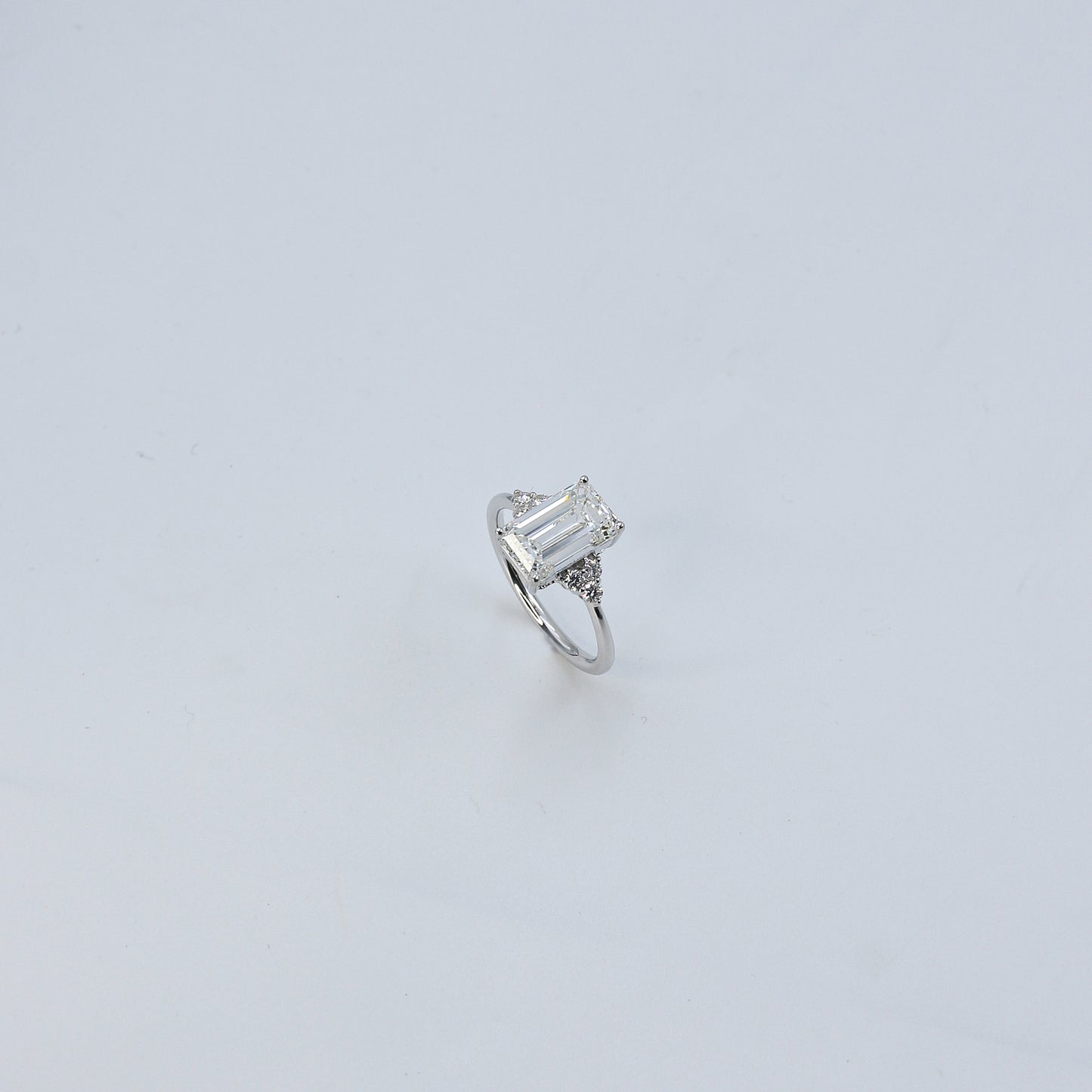 White Gold Emerald Cut Solitaire Diamond Ring with Side Accents