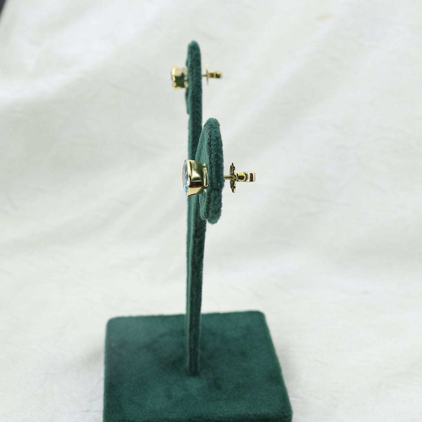 Yellow Gold Blue Topaz Oval Stud Earrings