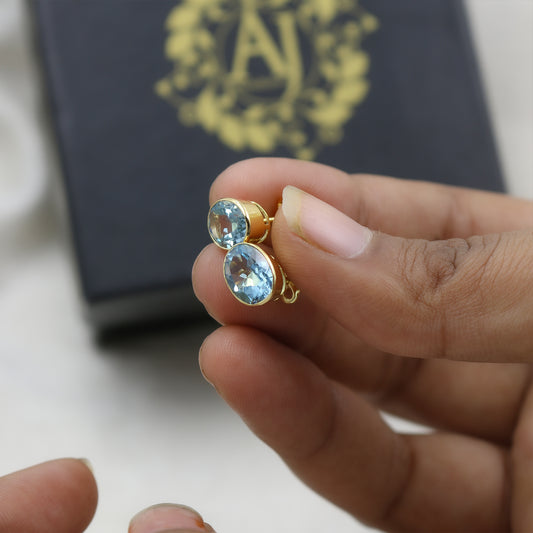 Yellow Gold Blue Topaz Oval Stud Earrings
