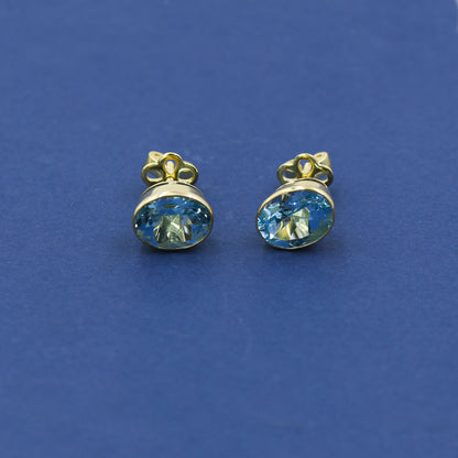 Yellow Gold Blue Topaz Oval Stud Earrings