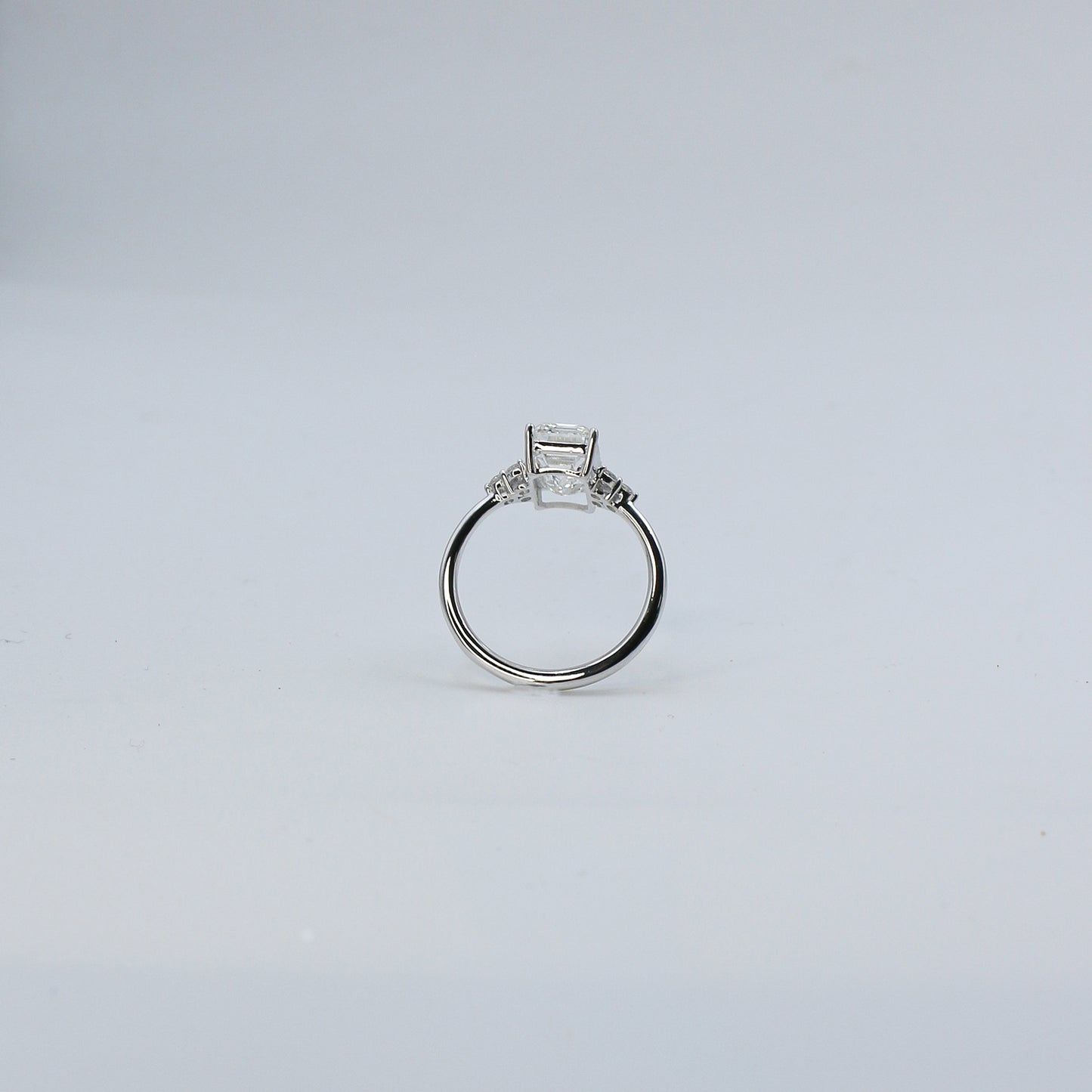 White Gold Emerald Cut Solitaire Diamond Ring with Side Accents