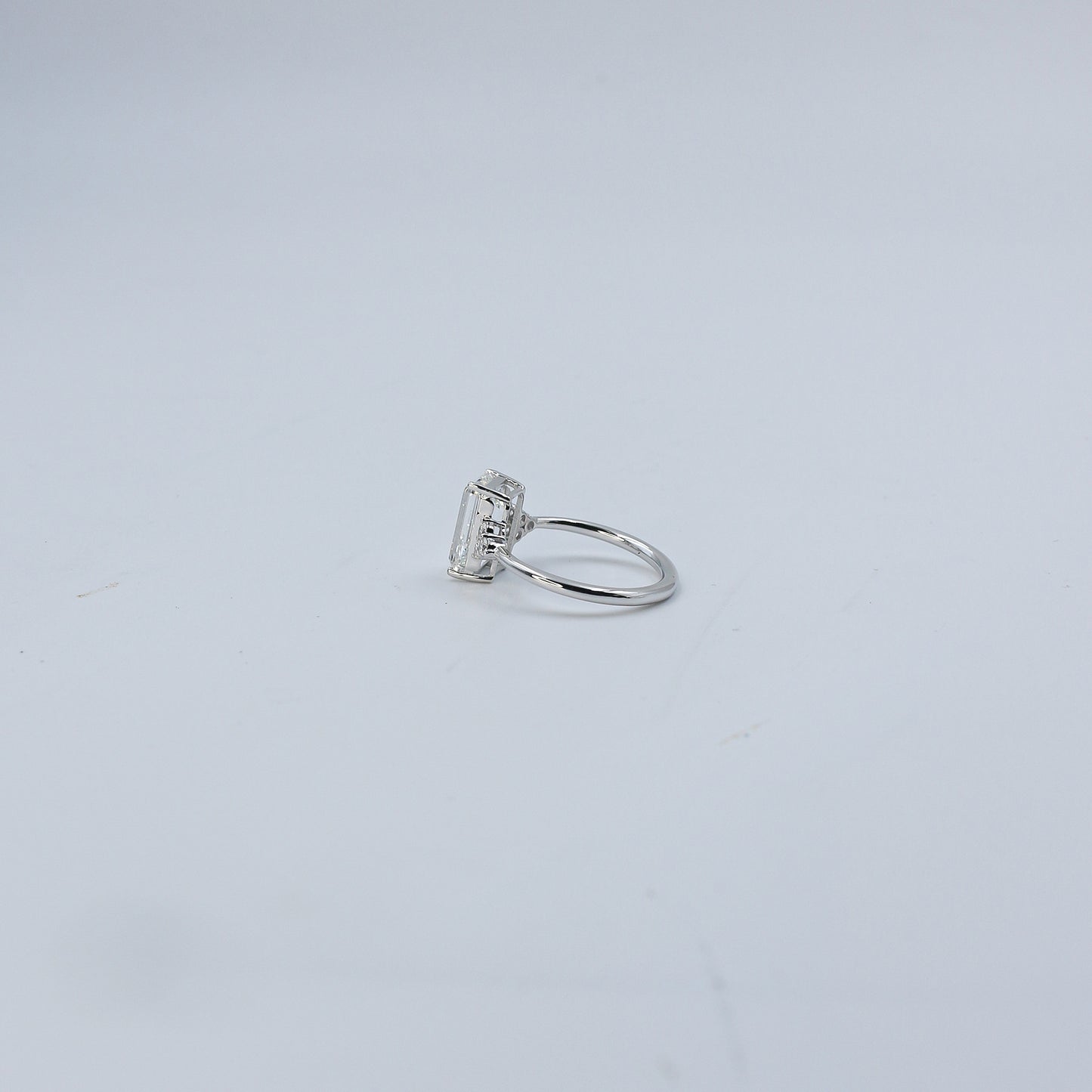 White Gold Emerald Cut Solitaire Diamond Ring with Side Accents
