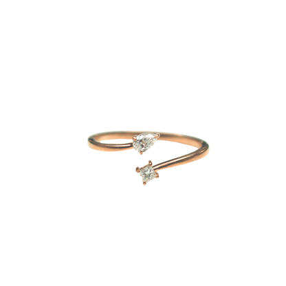 Rose gold ring with two small gemstones on a white background