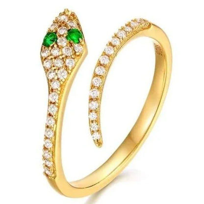 Gold bracelet with green gemstones on a white background